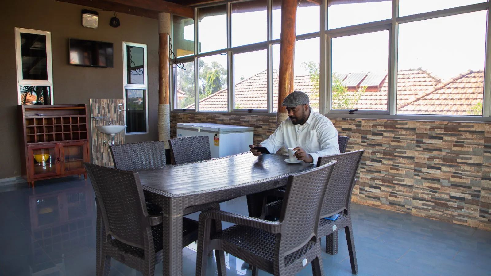 The Gardenia three-bedroom apartment dining and terrace lounge with wide windows