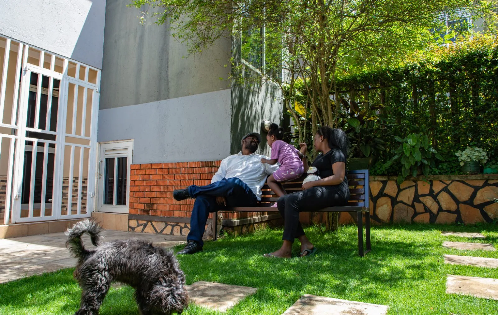 Private garden and backyard with seating and a family relaxing